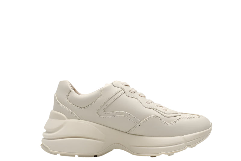 Beige sneaker on a light gray background