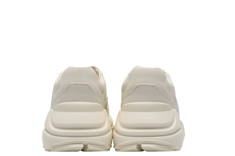 Pair of beige sneakers on a white background