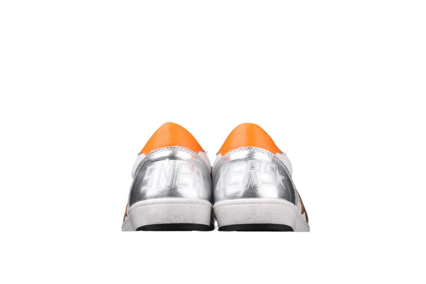 Pair of silver sneakers with orange tips on a black background