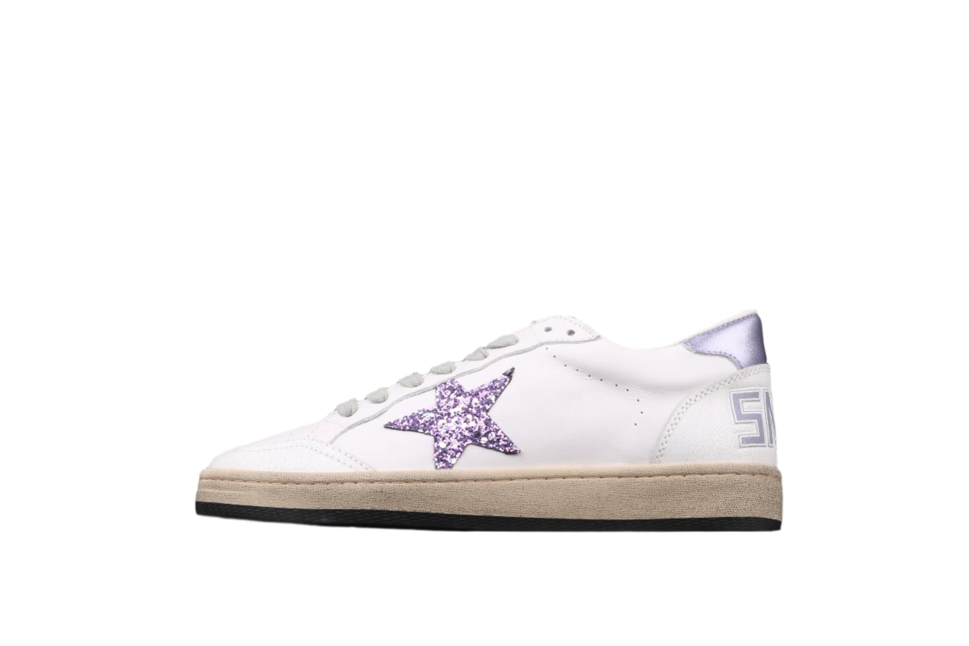 White sneaker with purple star design on a black background