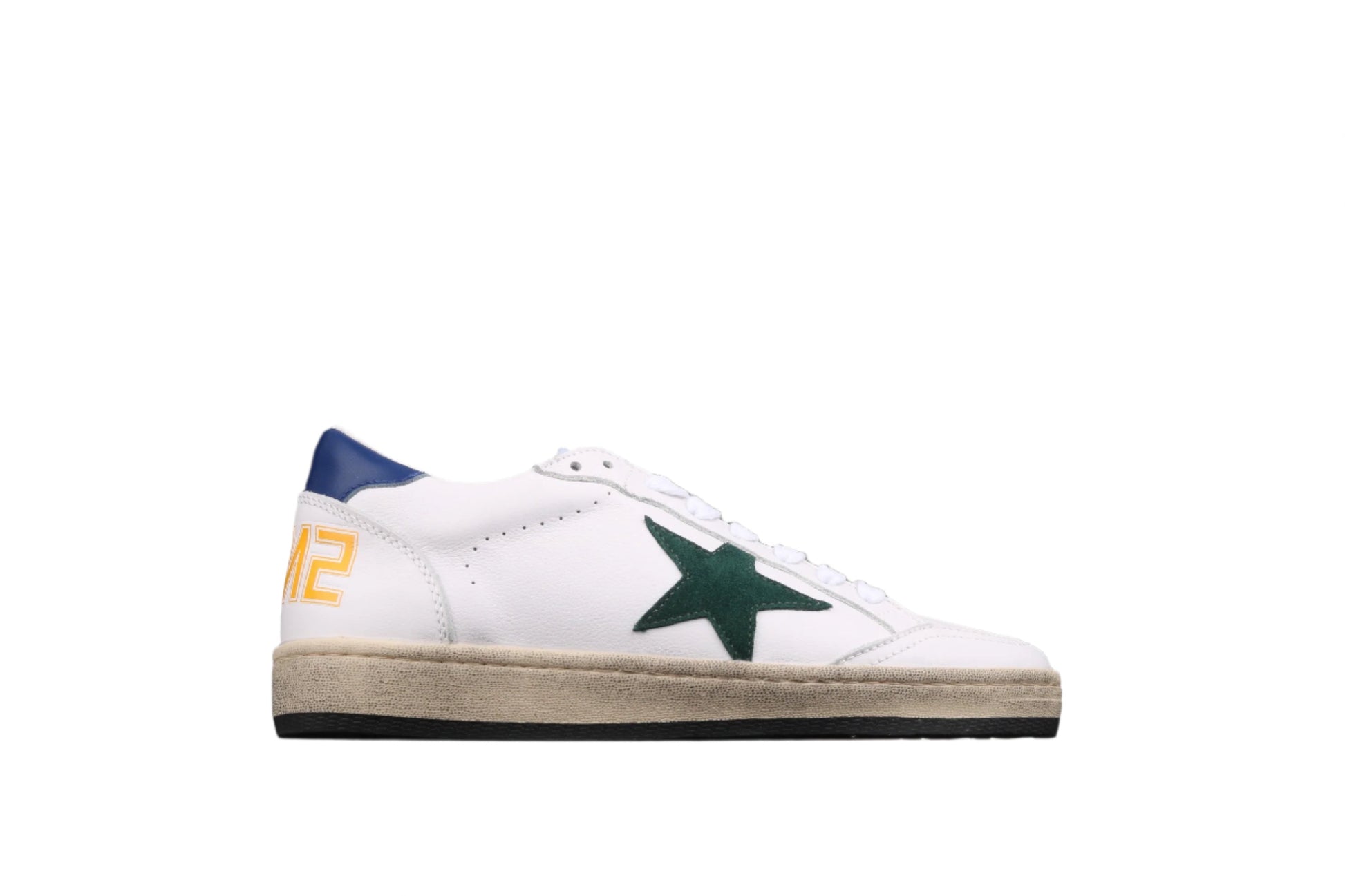 White sneaker with green star and blue accents on a black background