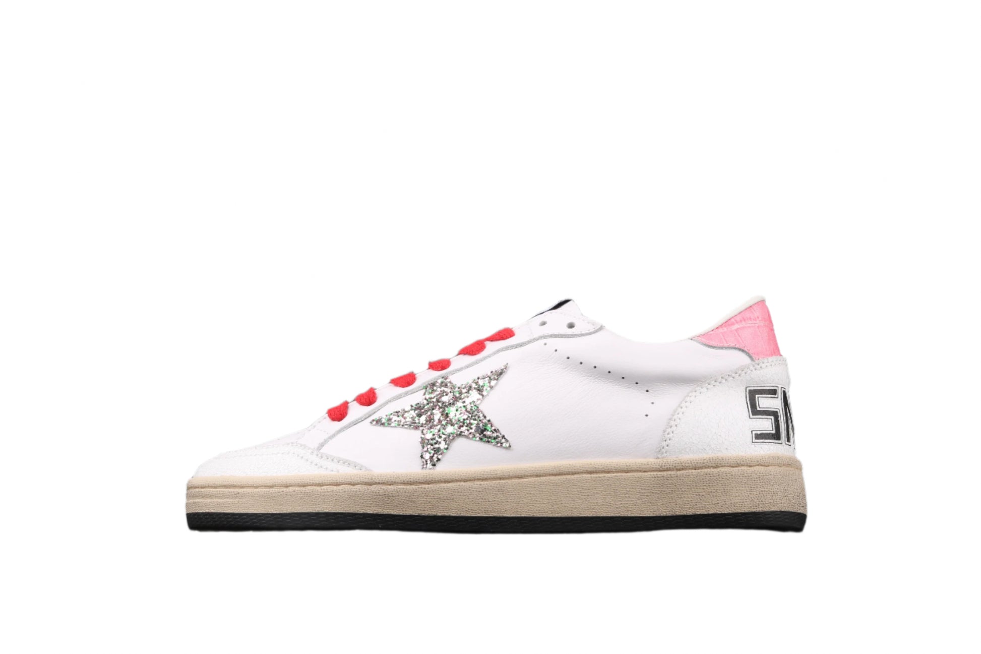 White sneaker with red accents and a decorative element on a black background