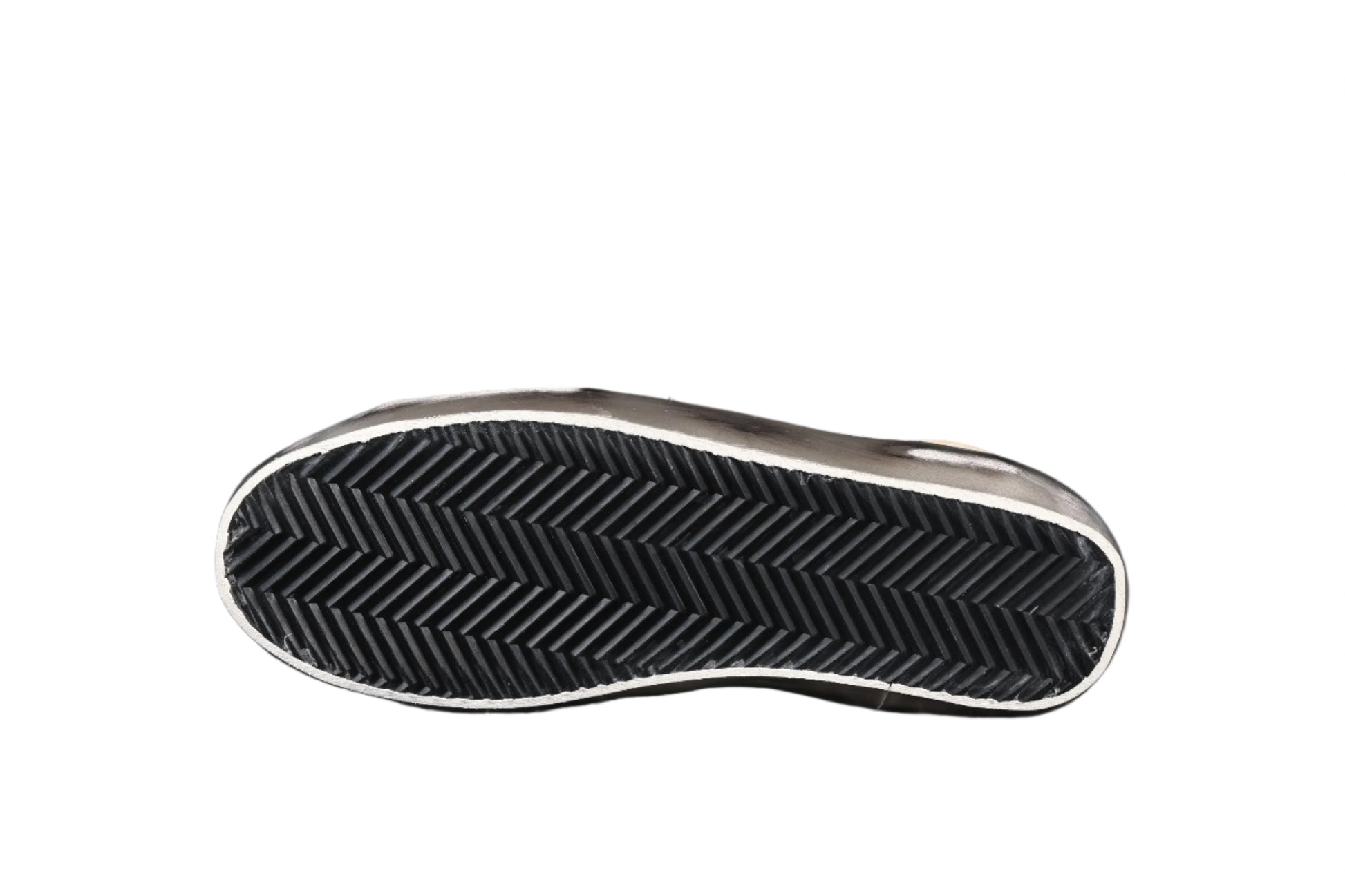Close-up of a black and silver sneaker sole on a black background