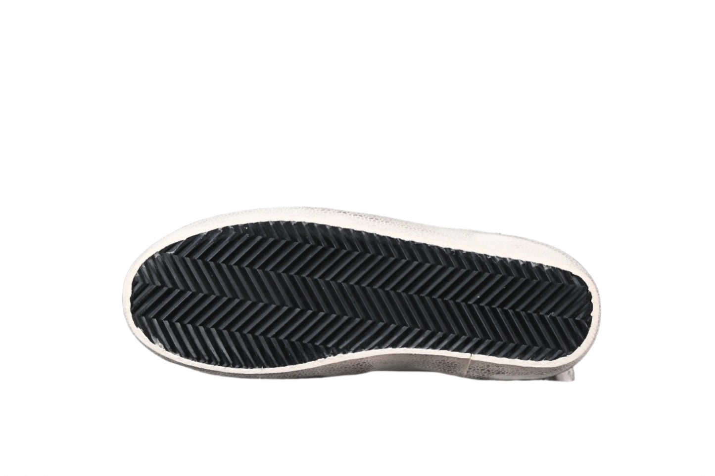 Black and white sneaker sole on a black background