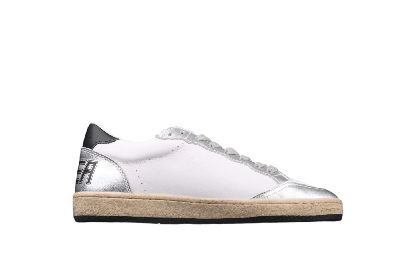 White sneaker with a metallic heel on a black background